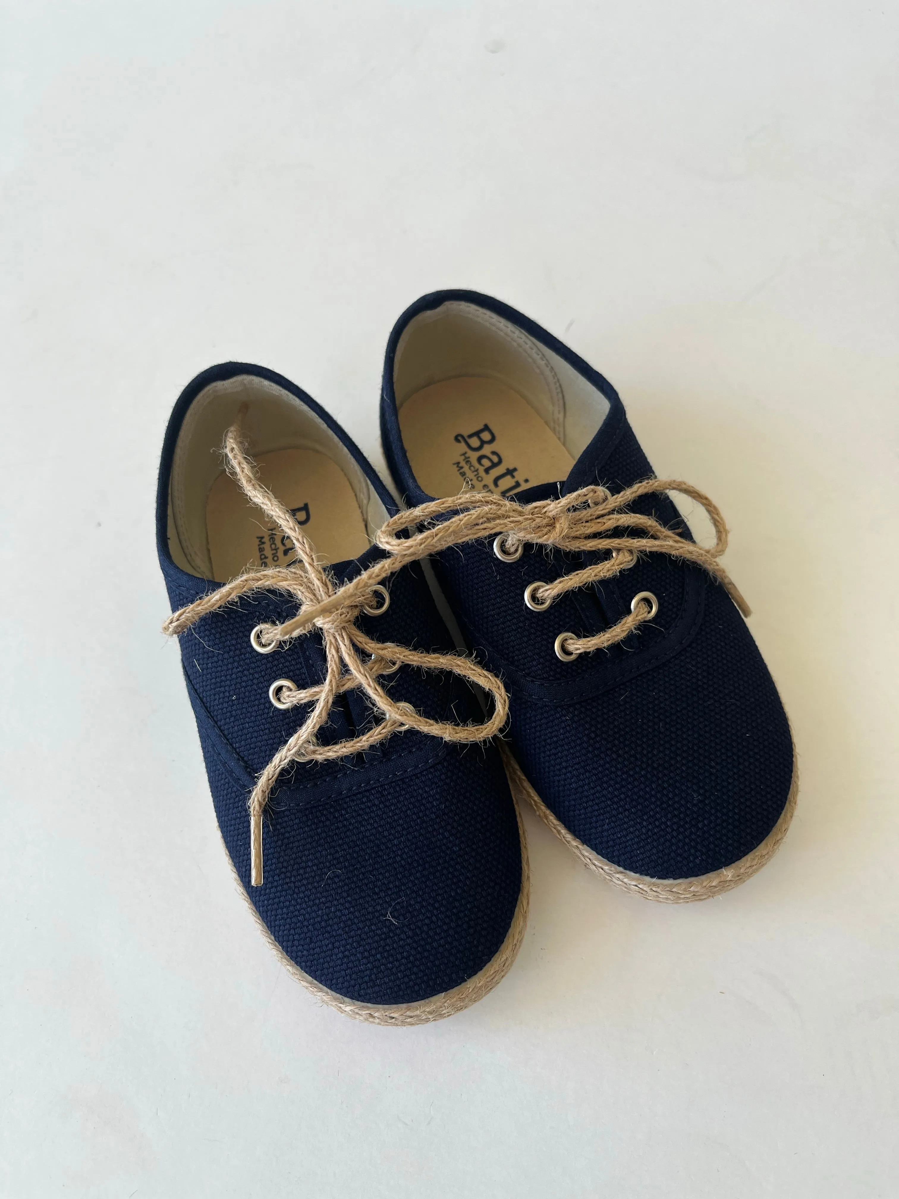 Navy canvas with jute sole and tie.
